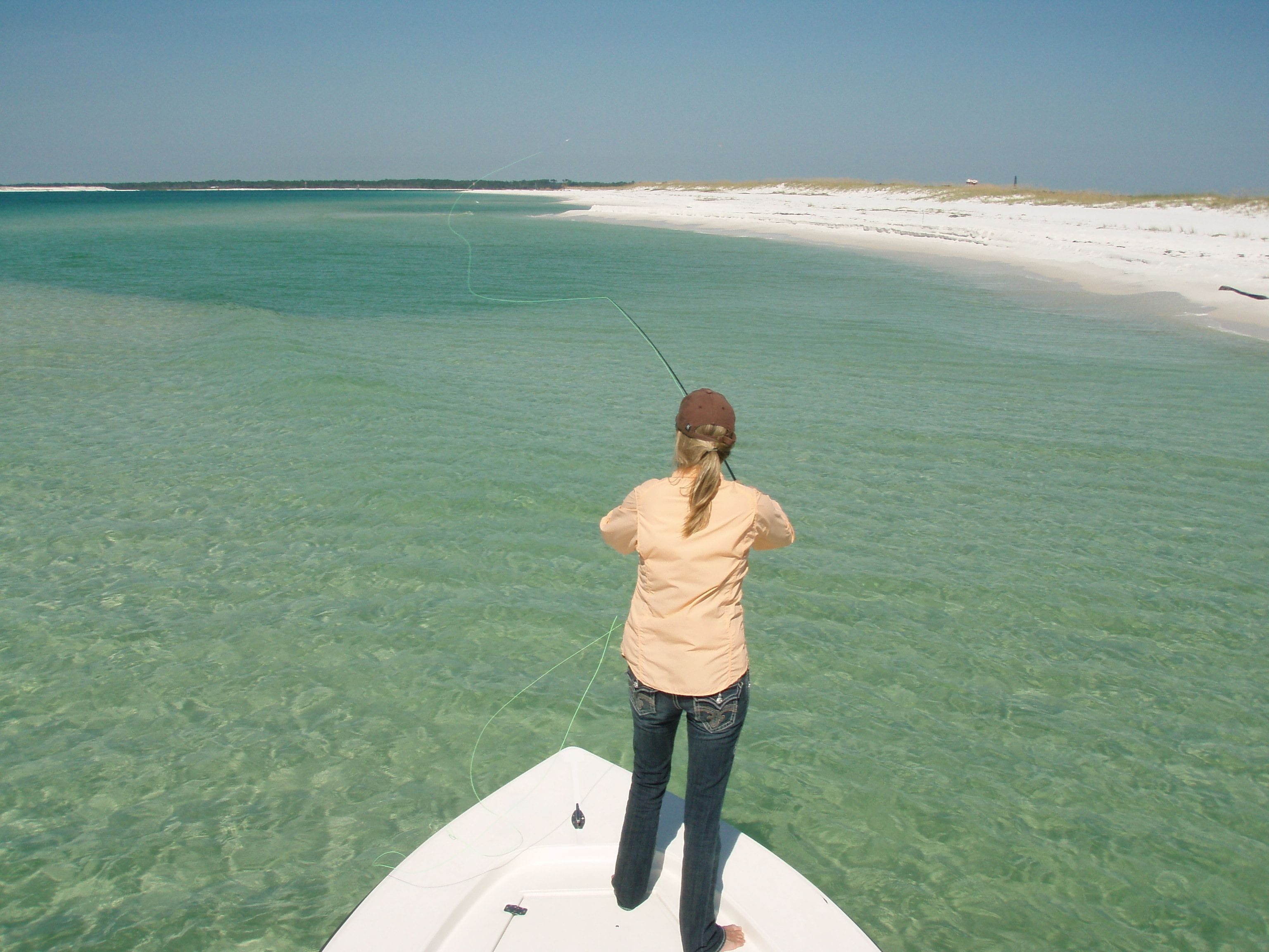 Captain smiling in afternoon light after a day of fishing with client